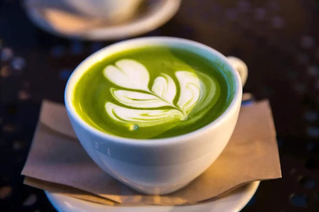 A bowl of vibrant green matcha tea